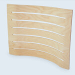 Assise de siège en contreplaqué hêtre galbé et usiné. Assise de siège en contreplaqué hêtre galbé et usiné.